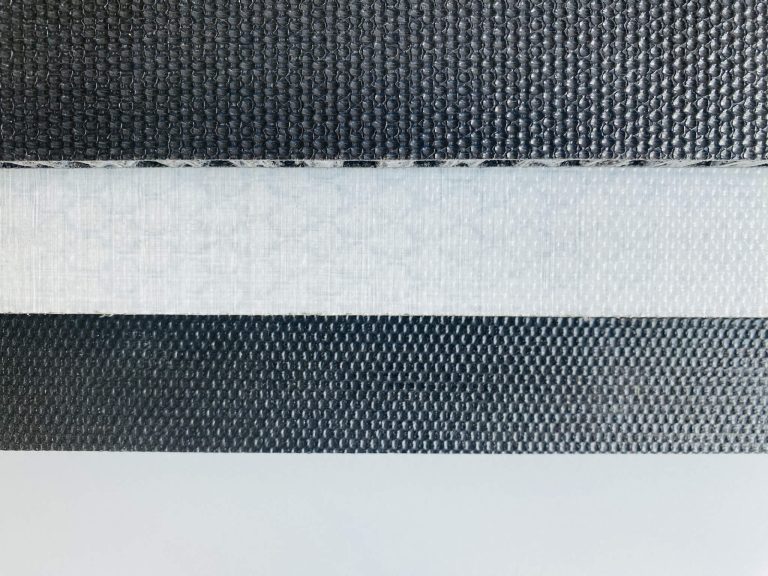 An image displaying the top surface of sandwich-structured Composite Floors, showcasing both black and white finishes, along with visible surface textures.