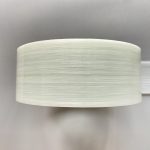 A top-down view image of a roll of glass fiber HDPE tape.