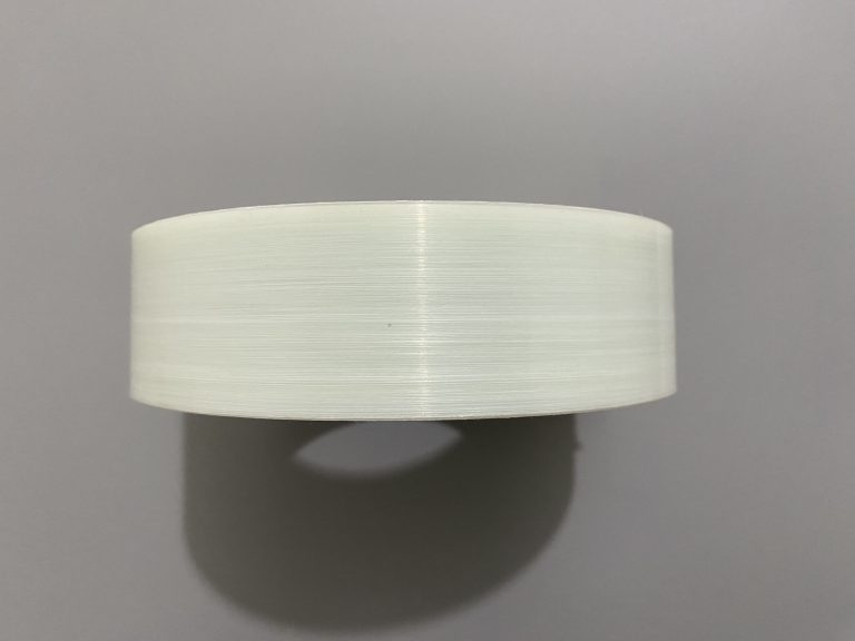 A top-down view image of a roll of glass fiber PP tape.