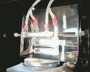 Solar-powered flow reactor converting CO2 from air into syngas, with solar panels and internal mechanisms highlighted.